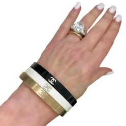 Vintage Chanel Bangle Set Of 3: In Gold Tone, White, & Black Resin With CC Logo -Mode Bijouterie Magasin BWG OM1 master