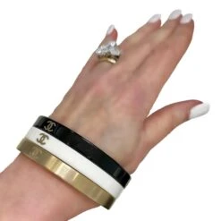 Vintage Chanel Bangle Set Of 3: In Gold Tone, White, & Black Resin With CC Logo -Mode Bijouterie Magasin BWG OM2 master