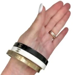 Vintage Chanel Bangle Set Of 3: In Gold Tone, White, & Black Resin With CC Logo -Mode Bijouterie Magasin BWG OM4 master