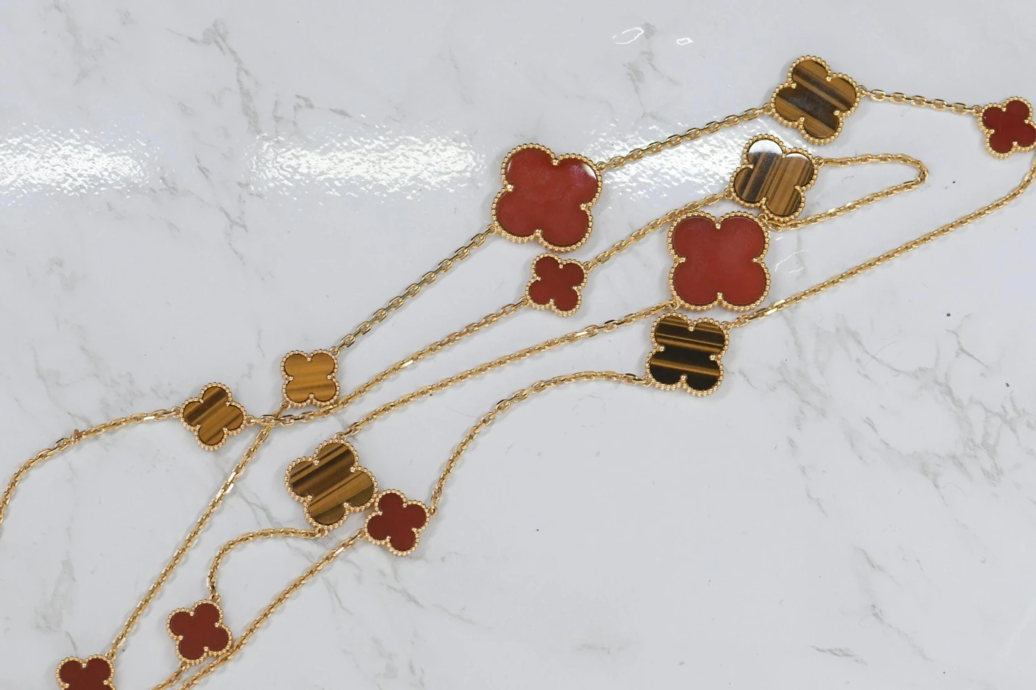 Van Cleef & Arpels Magic Alhambra 16 Motifs Tiger Eye And Carnelian Long Necklac 5 Van Cleef & Arpels Magic Alhambra 16 Motifs Tiger Eye And Carnelian Long Necklac – Image 3